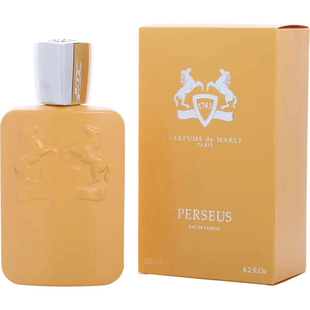 A bottle of Perseus Eau de Parfum next to its packaging box. The bottle and box are a warm golden-yellow color with a silver metallic cap and white printed branding.