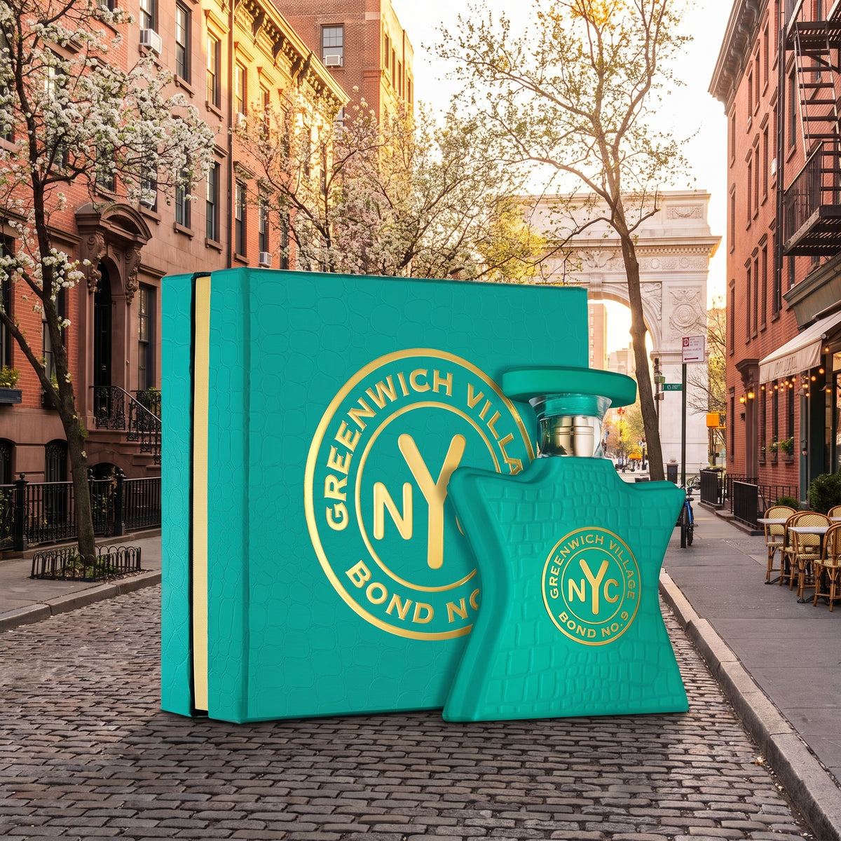 Greenwich Village Bond No. 1 perfume bottle and matching box displayed on a cobblestone city street.