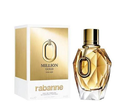 Rabanne Million Gold For Her Eau de Parfum bottle and its packaging box, featuring a faceted gold and clear glass bottle with a gold cap next to a white and gold box.