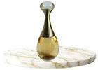 Decorative bottle with a white cap on a marble surface