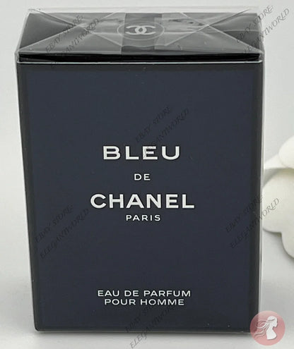 Chanel Bleu de Chanel Eau de Parfum for men, shown in its original dark navy blue box with white lettering, sealed in clear plastic.